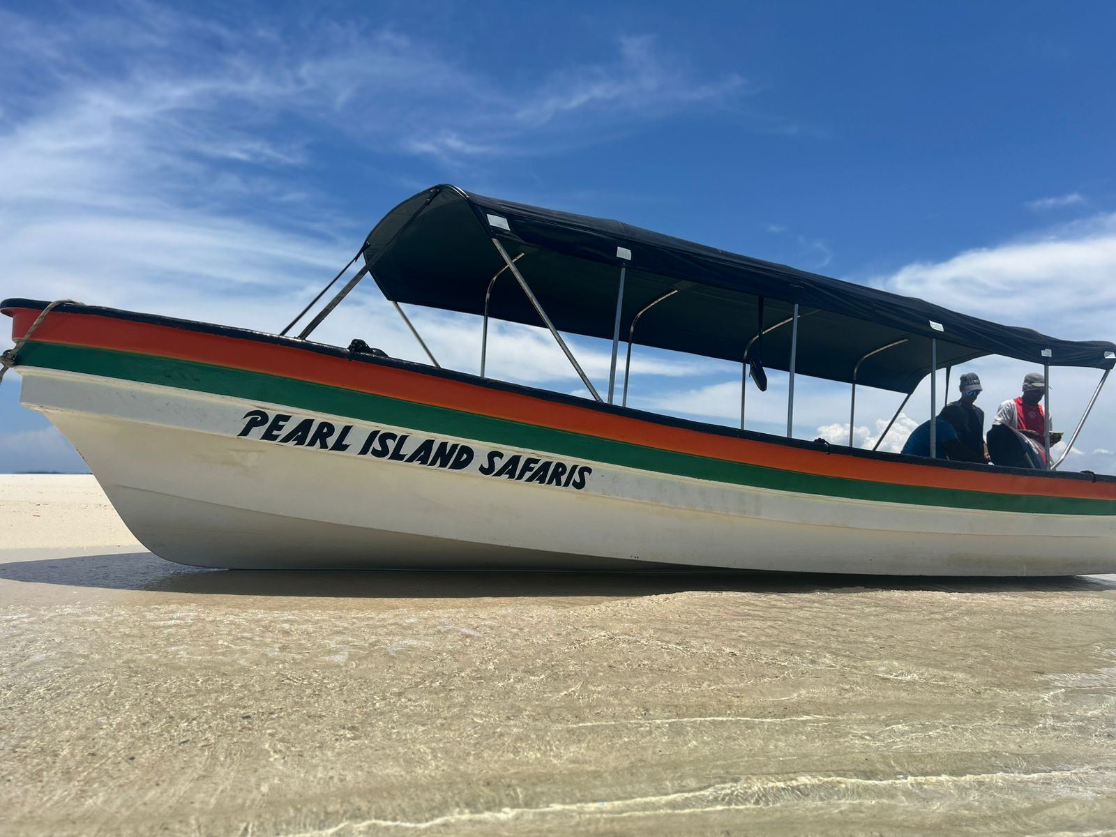 The Pearl Island Safaris boat on a sandbar