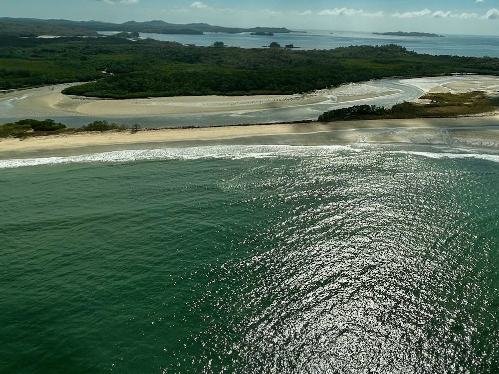 Sandbars and channels in a river mouth behind the beach at low water